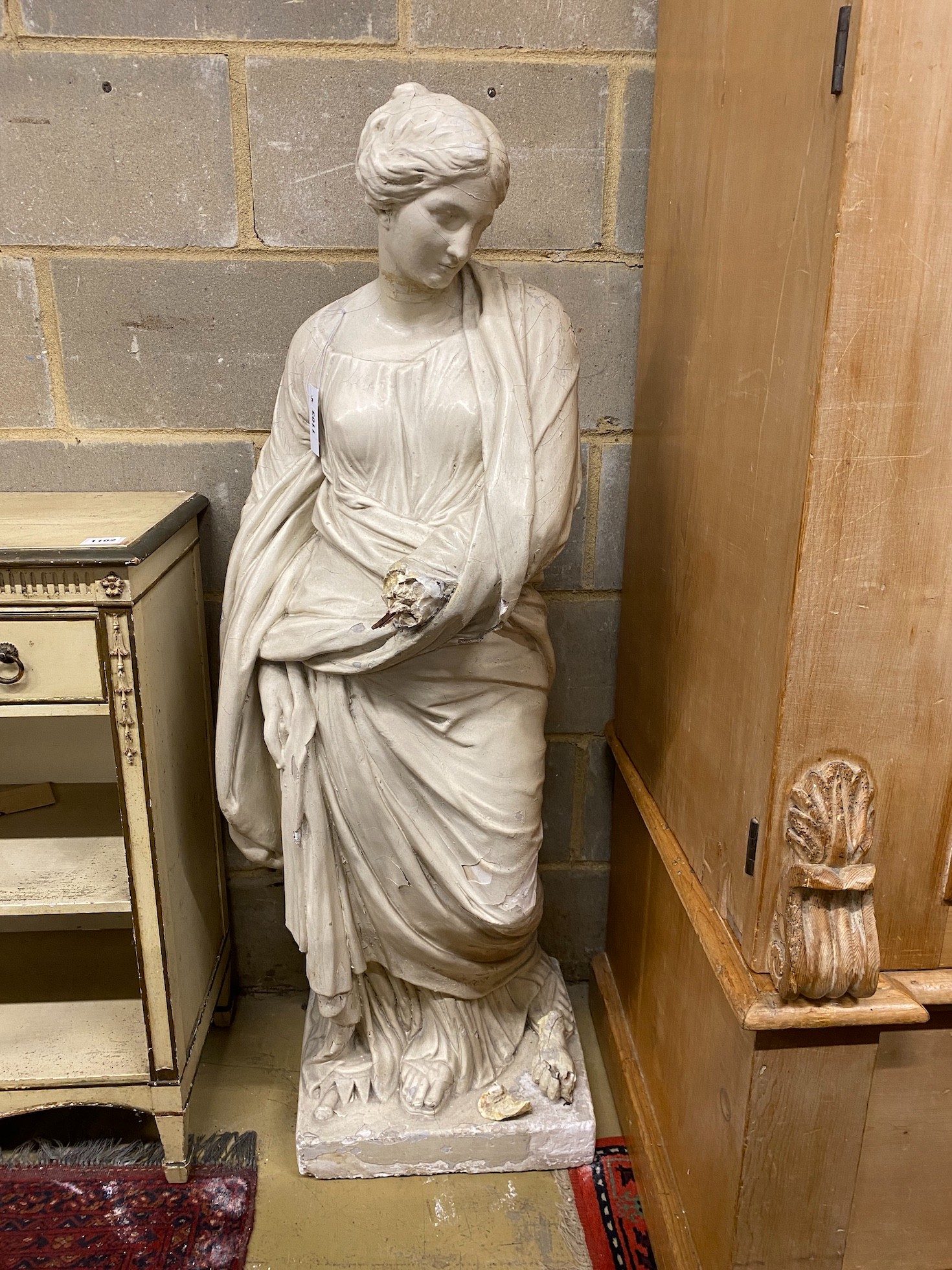 After the antique. A painted plaster figure of a classical woman (a.f.), height 127cm